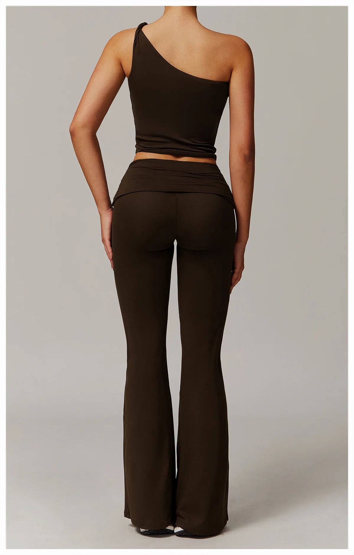 Xooie Fit flare leg workout set in black with one-shoulder top and high-waisted flared pants