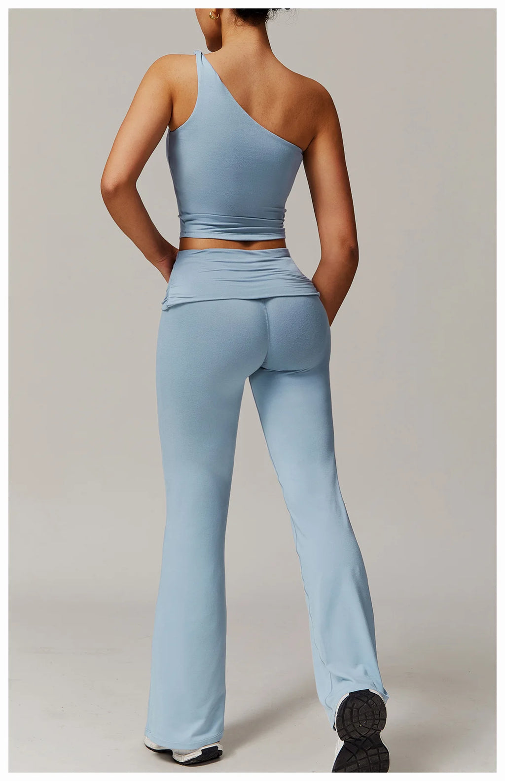Xooie Fit light blue flare leg workout set with high-waisted pants and one-shoulder top