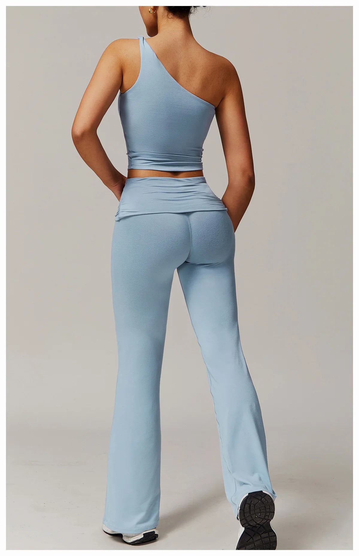 Xooie Fit light blue flare leg workout set with high-waisted pants and one-shoulder top