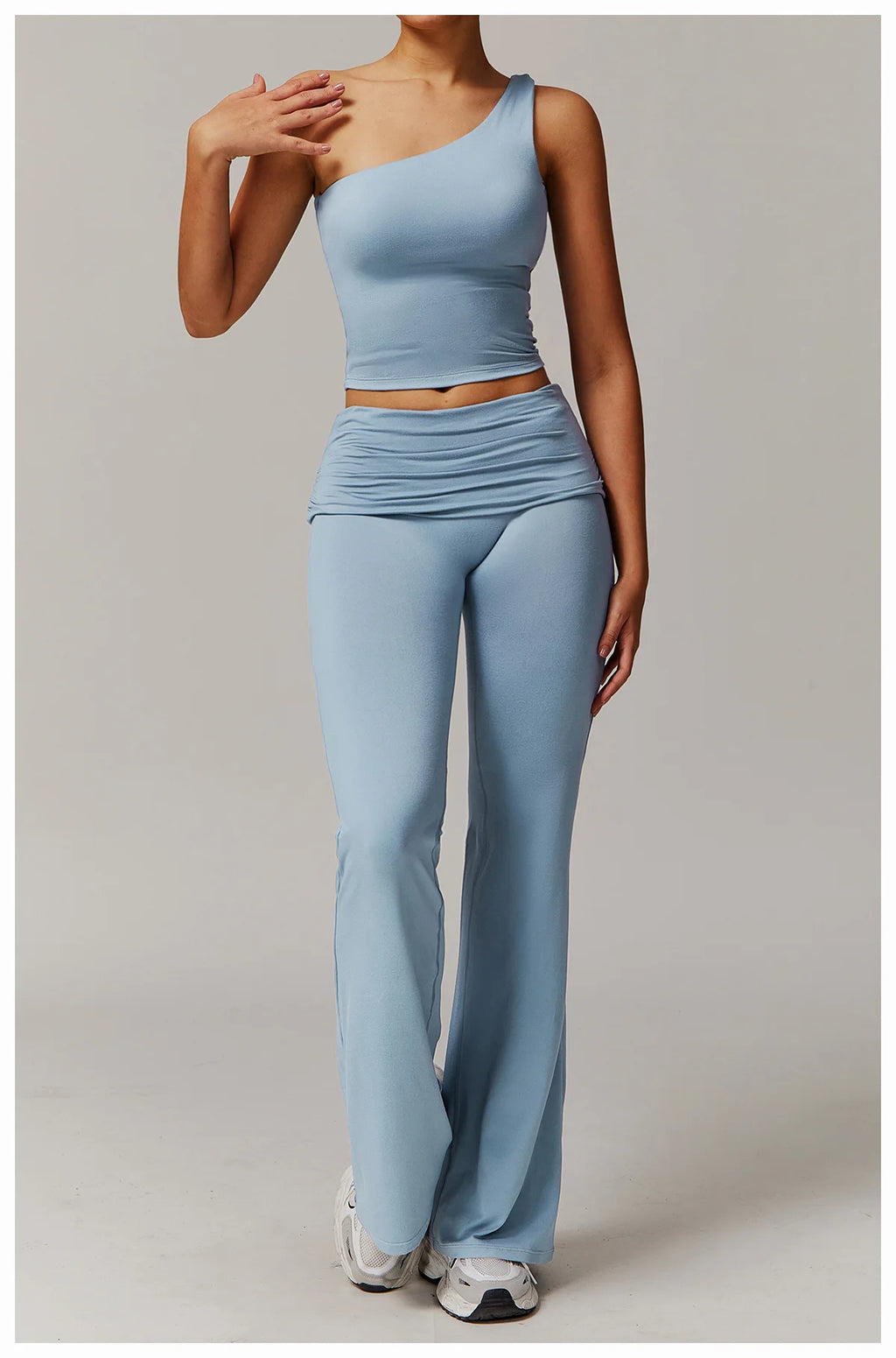 Xooie Fit light blue flare leg workout set with one-shoulder top and high-waisted flared pants