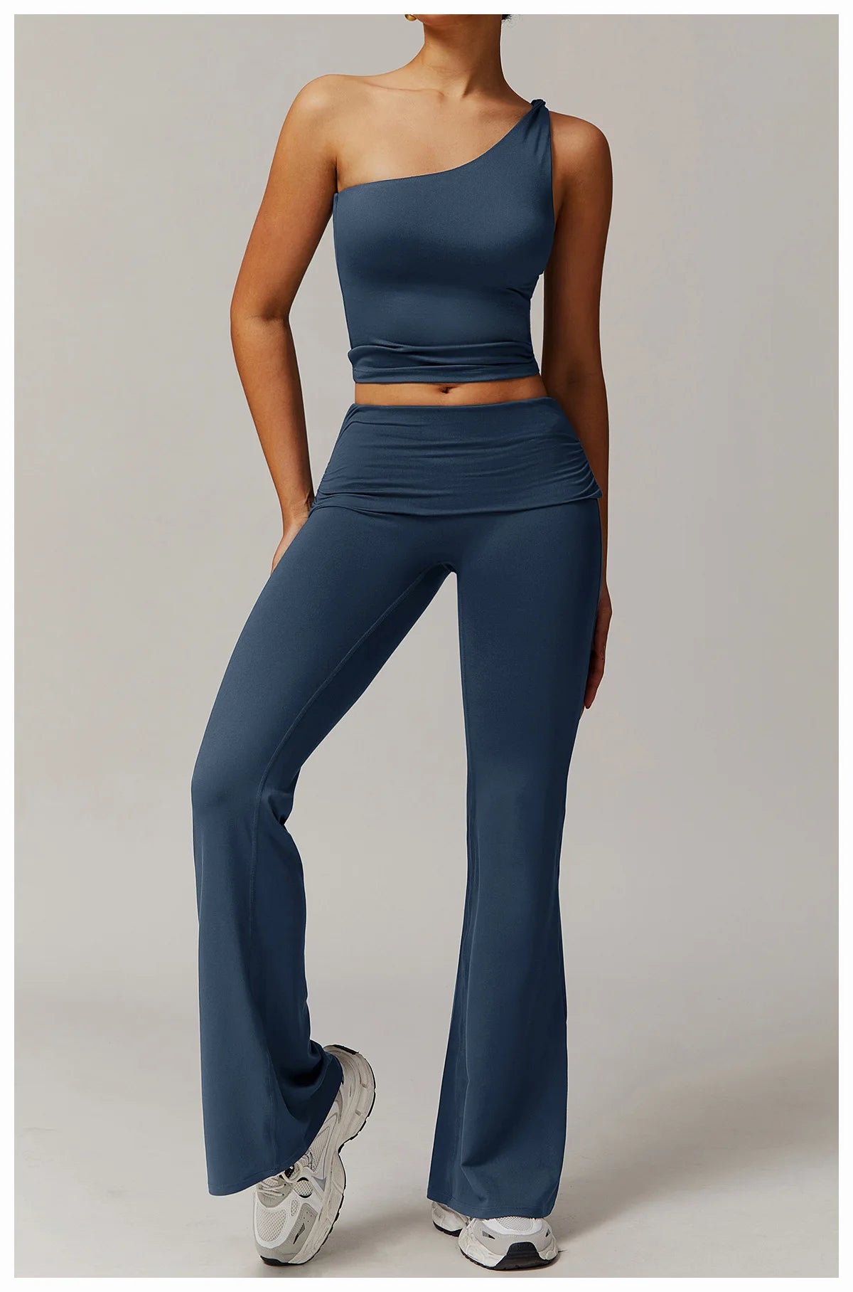 Xooie Fit flare leg workout set with one-shoulder crop top and high-waisted flare pants in blue