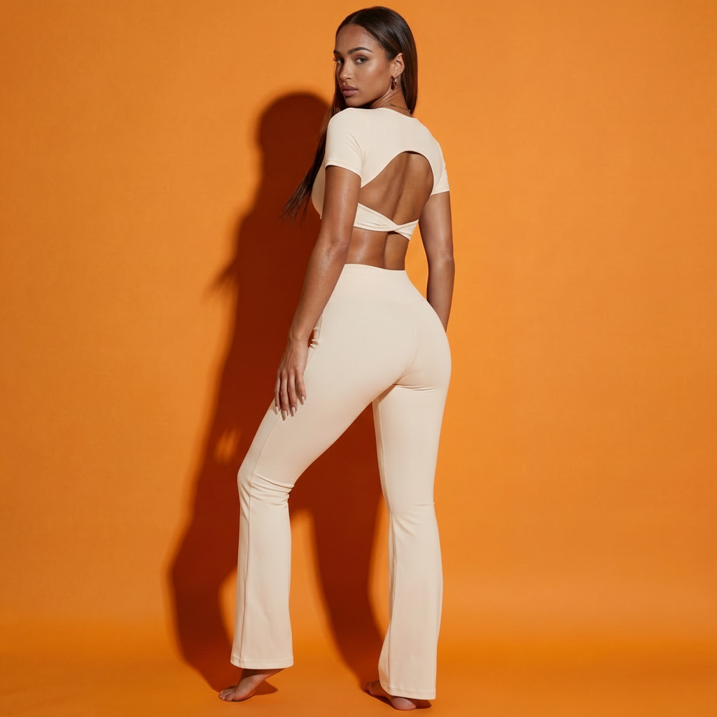 White twist front backless crop top with matching flared pants