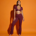Maroon twist front backless crop top and flared leggings matching set