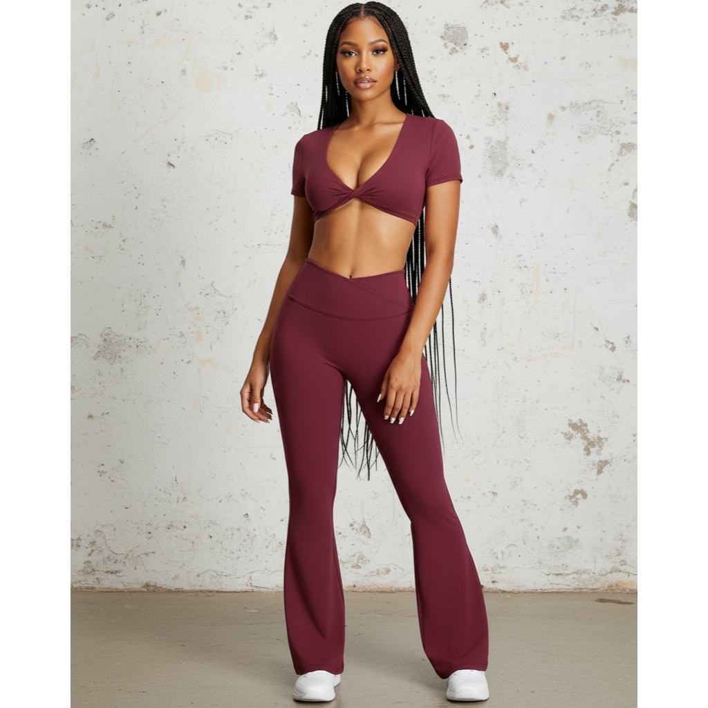 Stylish two-piece flare pants matching set for women in burgundy featuring a fitted crop top