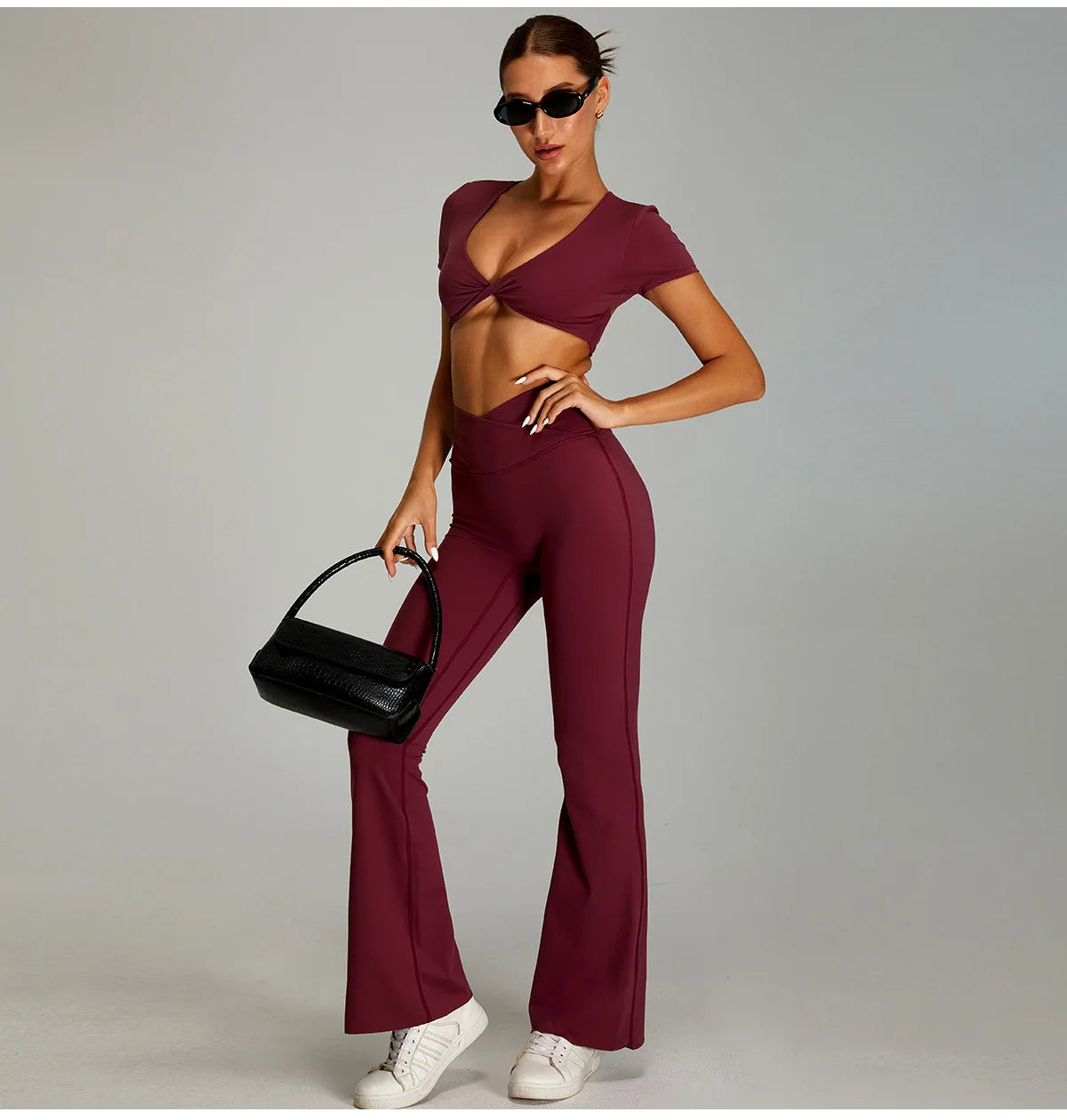 Stylish Xooie Fit two-piece flare pants matching set for women in burgundy with a chic crop top