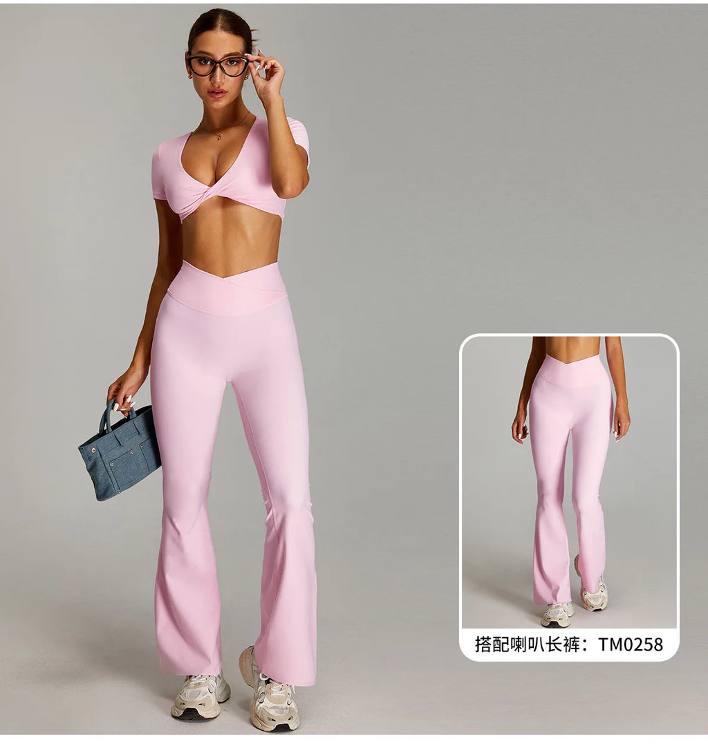 Xooie Fit flare pants matching set for women in pastel pink, featuring a crop top and flared pants