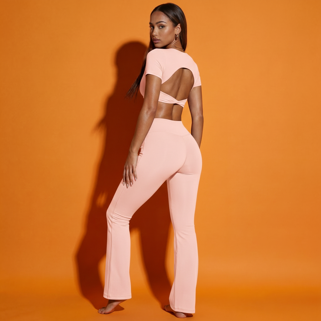 Pink twist front backless crop top with matching flared pants
