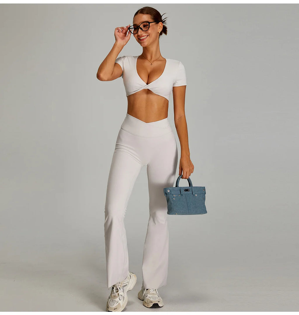 Xooie Fit two-piece flare pants matching set for women in white with a stylish cropped top