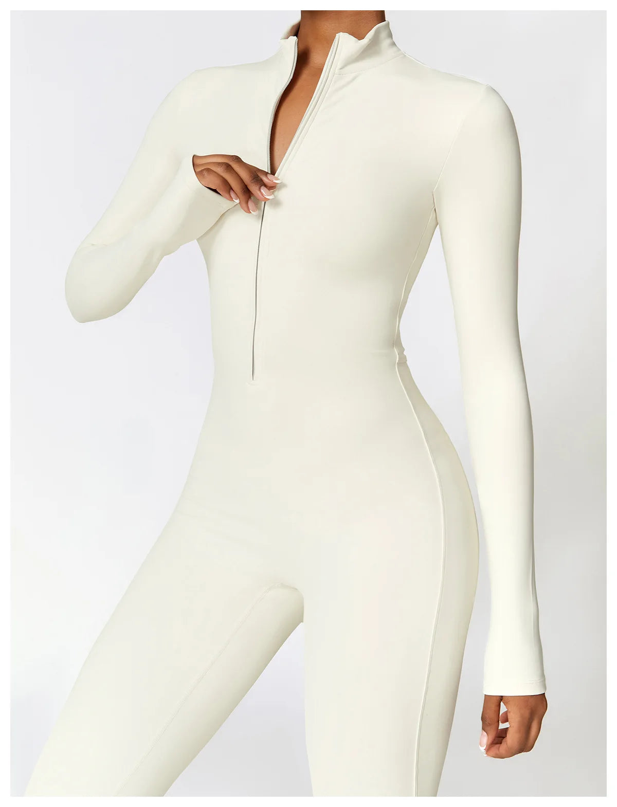 Xooie Fit fleece lined workout jumpsuit women in cream color with a high collar and long sleeves