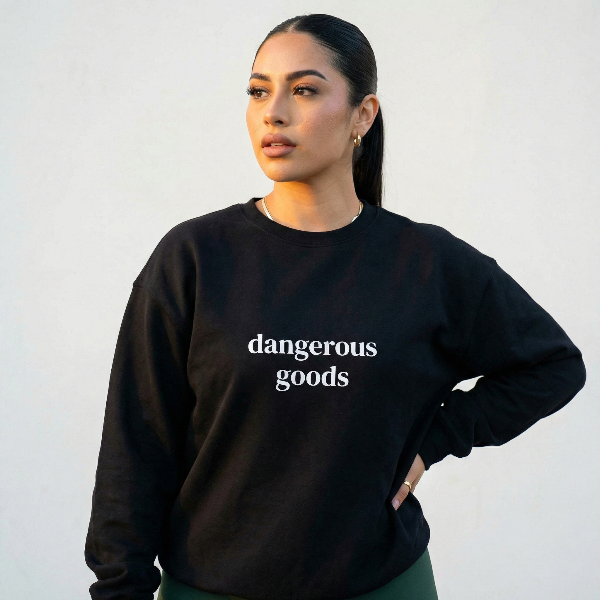 Black crewneck sweatshirt front text "dangerous goods"