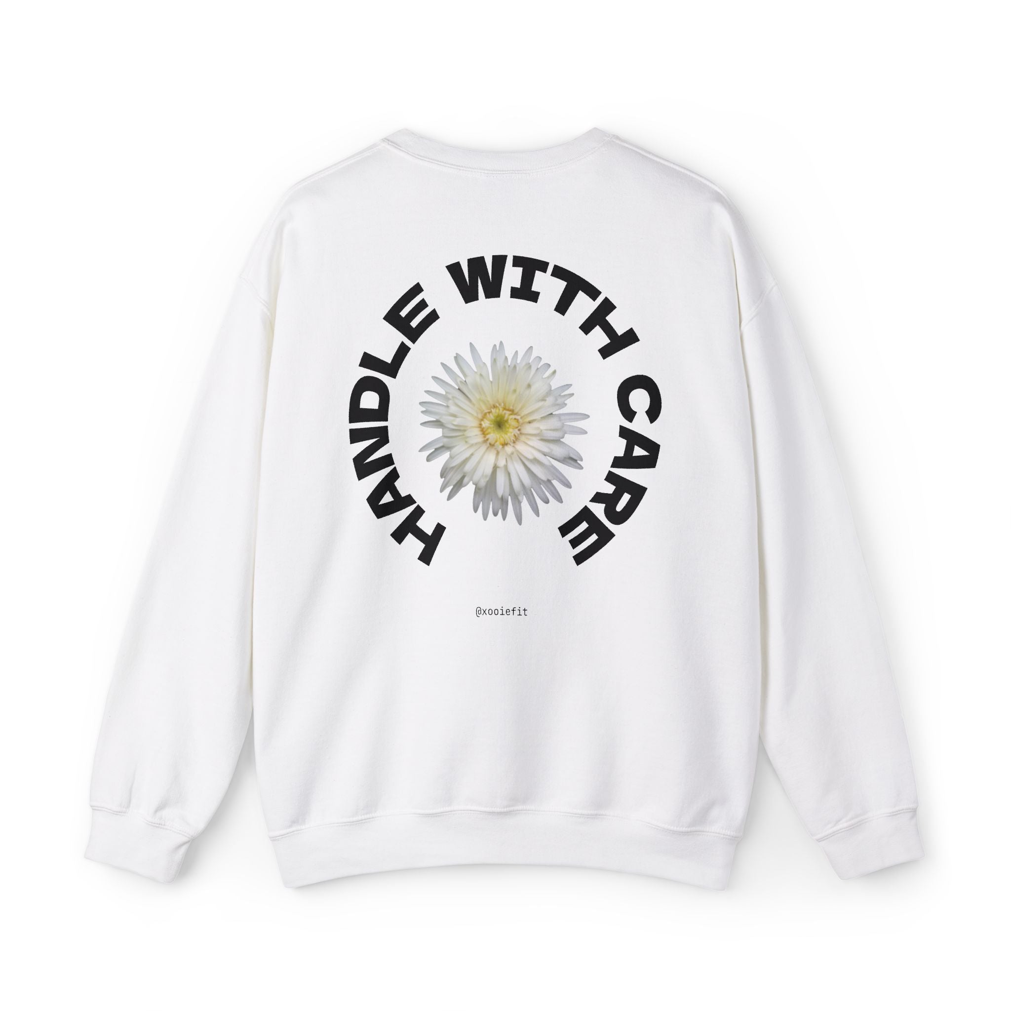 White crewneck sweatshirt, back circular daisy logo with "WITH CARE" text