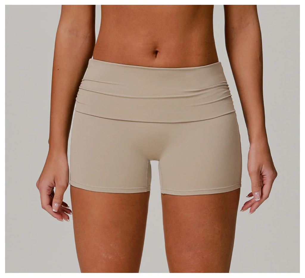 Xooie Fit beige foldable waistband yoga shorts for comfortable and flexible workout wear