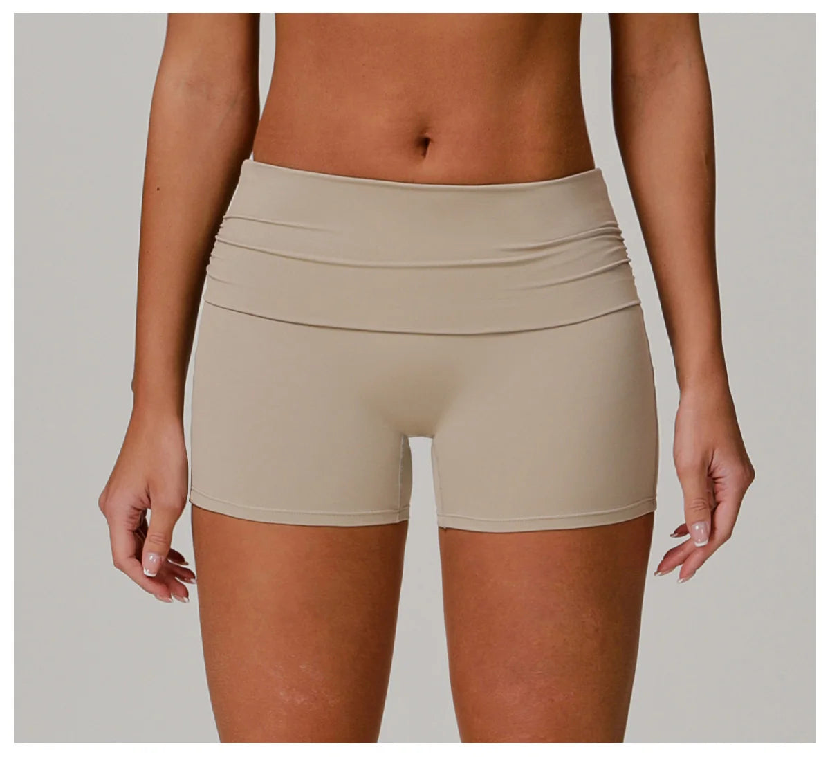 Xooie Fit beige foldable waistband yoga shorts for comfortable and flexible workout wear