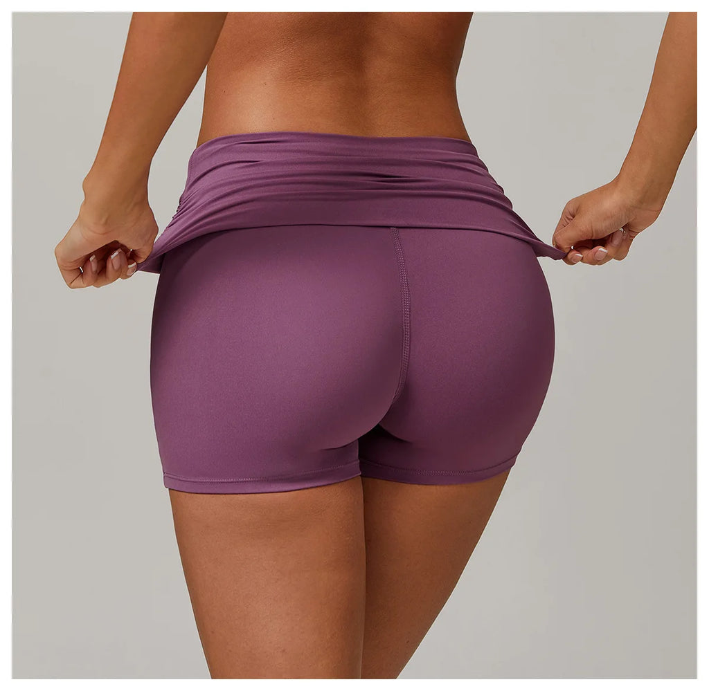 Xooie Fit purple foldable waistband yoga shorts shown from back on model
