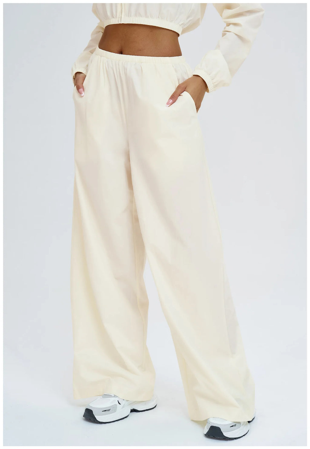 Light cream wide-leg yoga pants with gathered elastic waist and full length