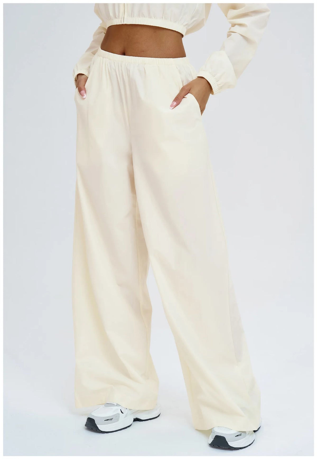 Light cream wide-leg yoga pants with gathered elastic waist and full length