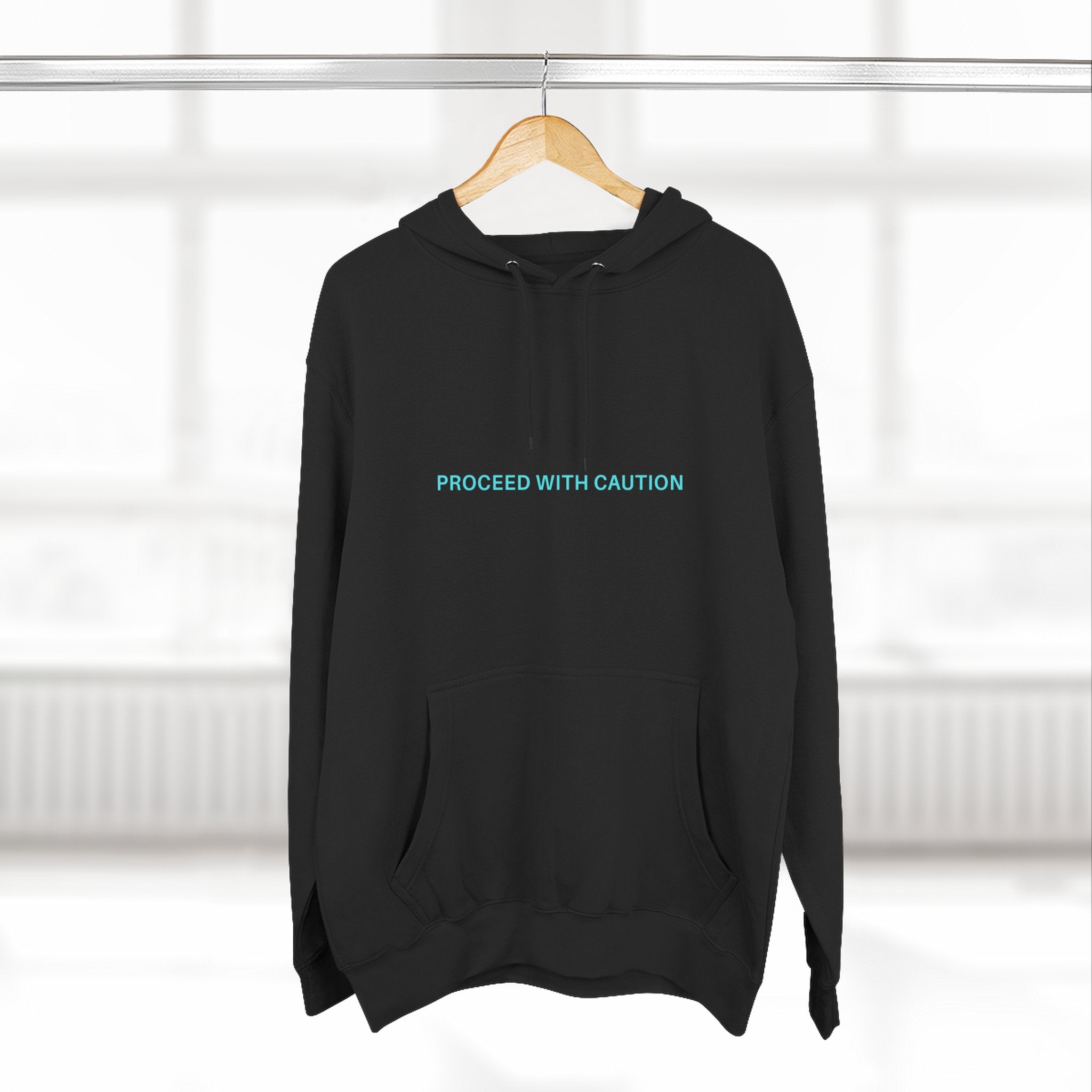 Proceed With Caution hoodie, Black; front pouch pocket, hood with drawstrings, small logo text
