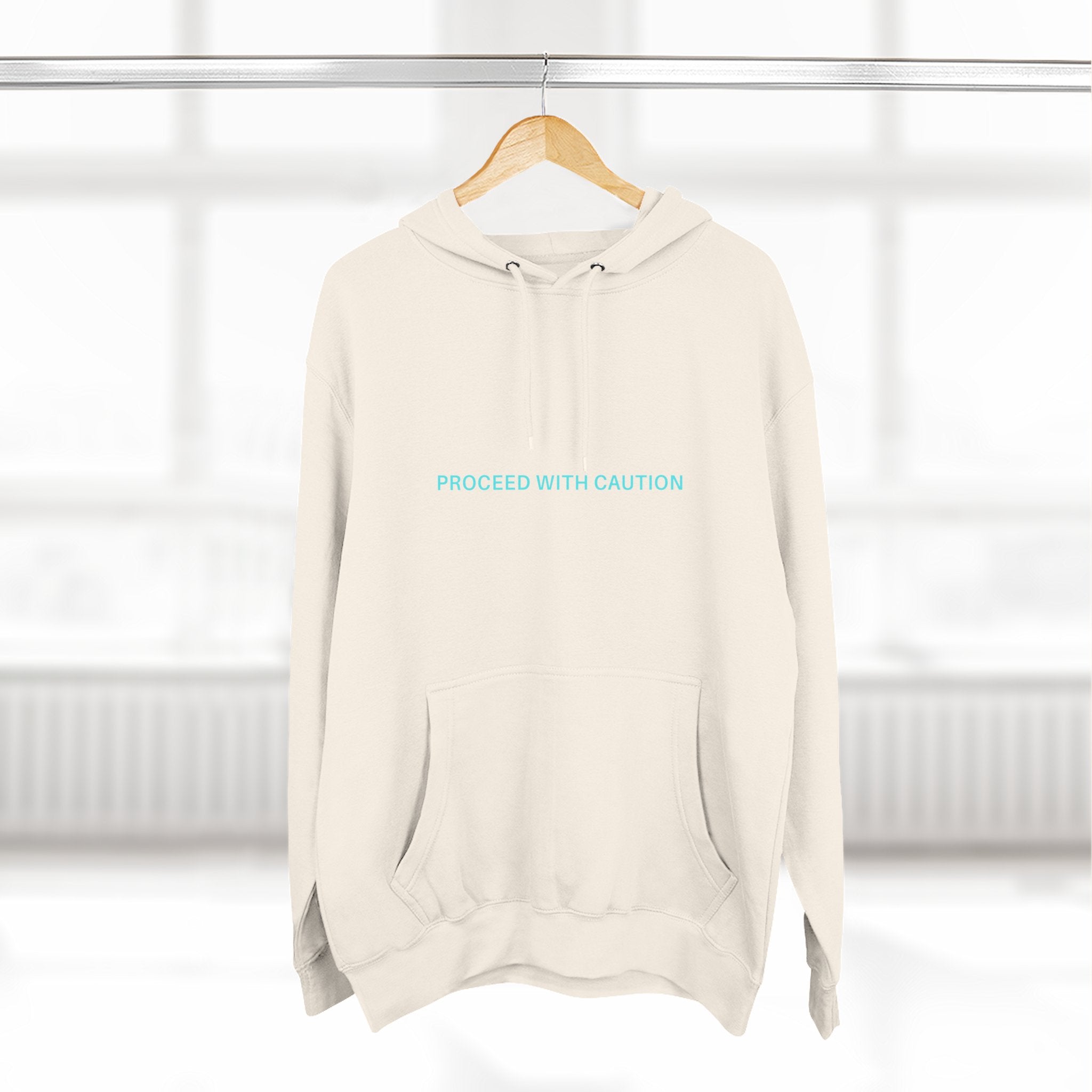 Proceed With Caution hoodie, Off White; front pouch pocket, hood with drawstrings, “PROCEED WITH CAUTION”