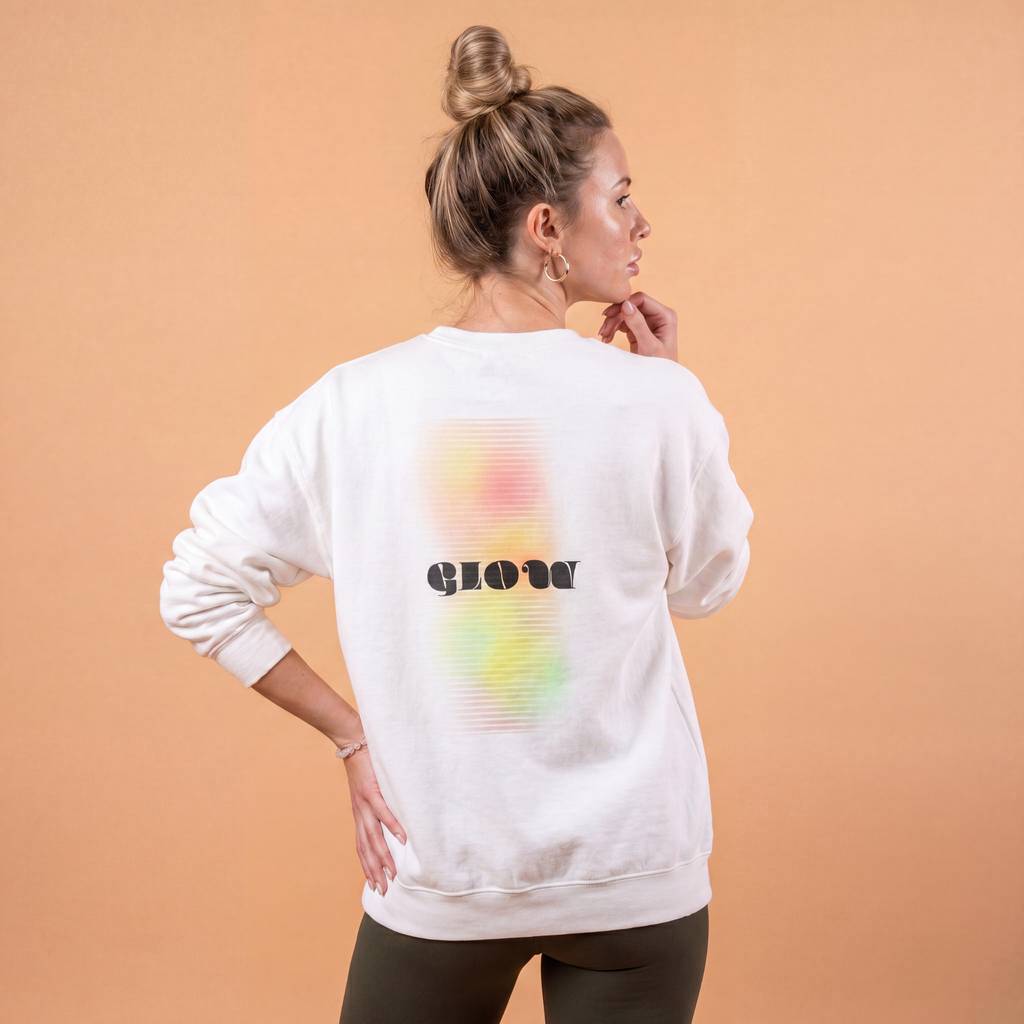 Stylish graphic sweatshirt in white featuring a colorful 'glow' design on the back