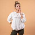 White crewneck sweatshirt with IRIDESCENT logo at chest