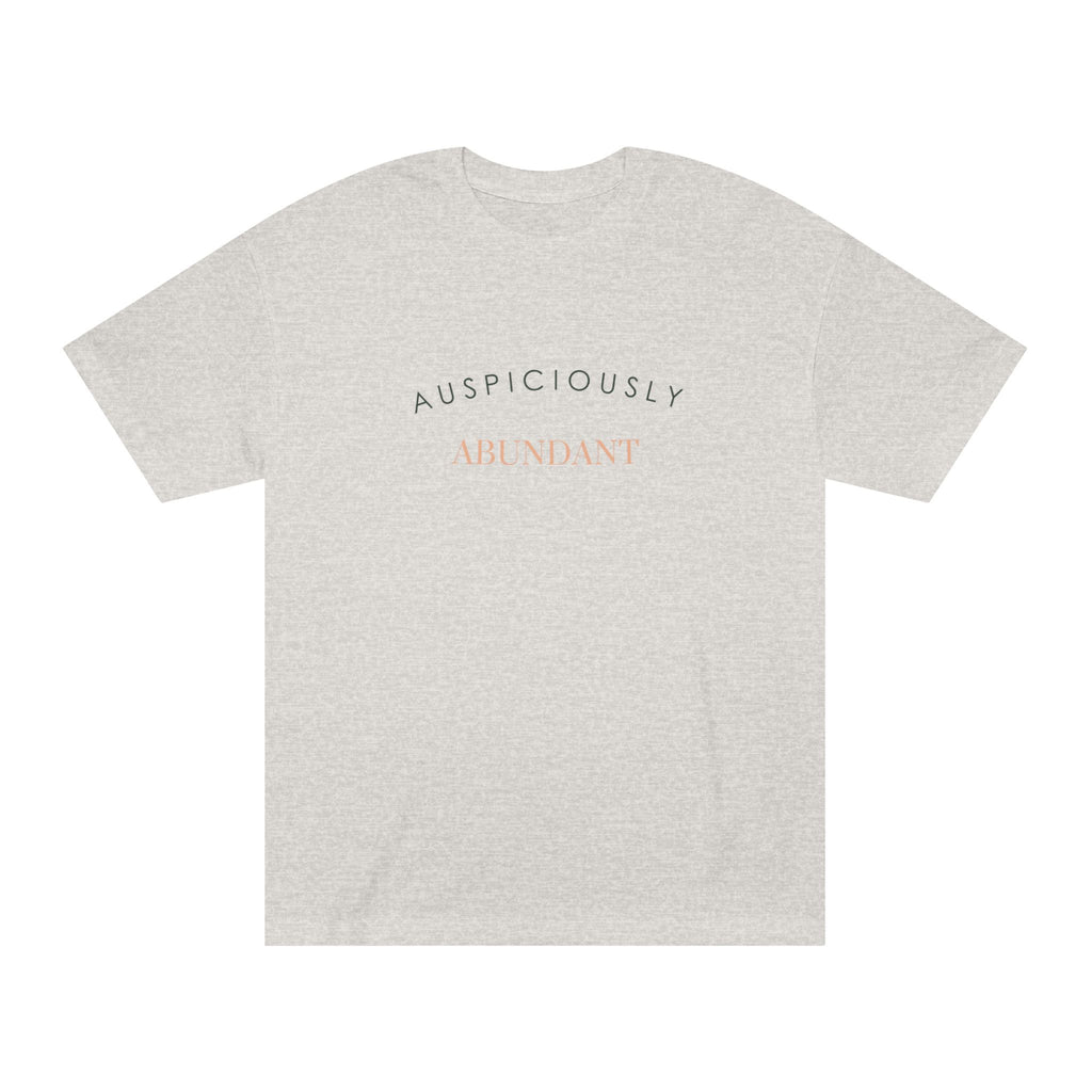Light grey crewneck T-shirt with “AUSPICIOUSLY ABUNDANT” text graphic on the front.
