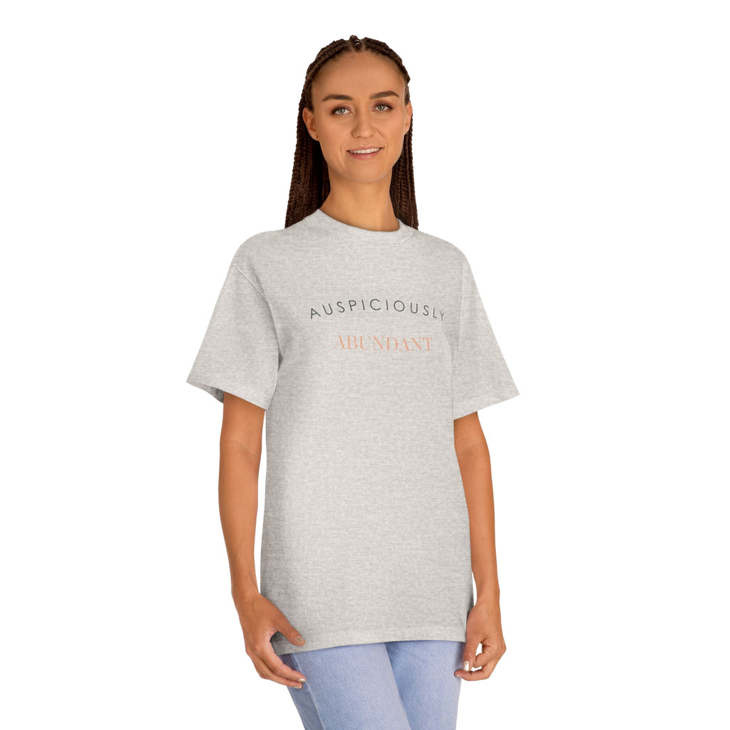 Silver grey crewneck tee with gold “Auspiciously Abundant” text graphic on front