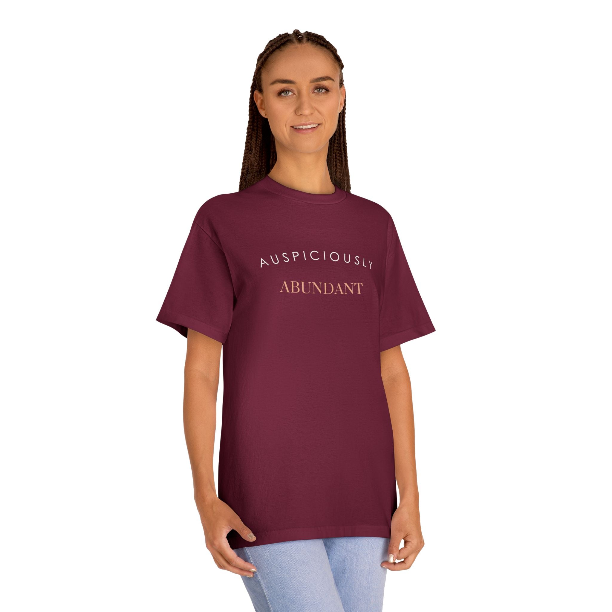 Burgundy crewneck tee with 'Auspiciously Abundant' text graphic across chest