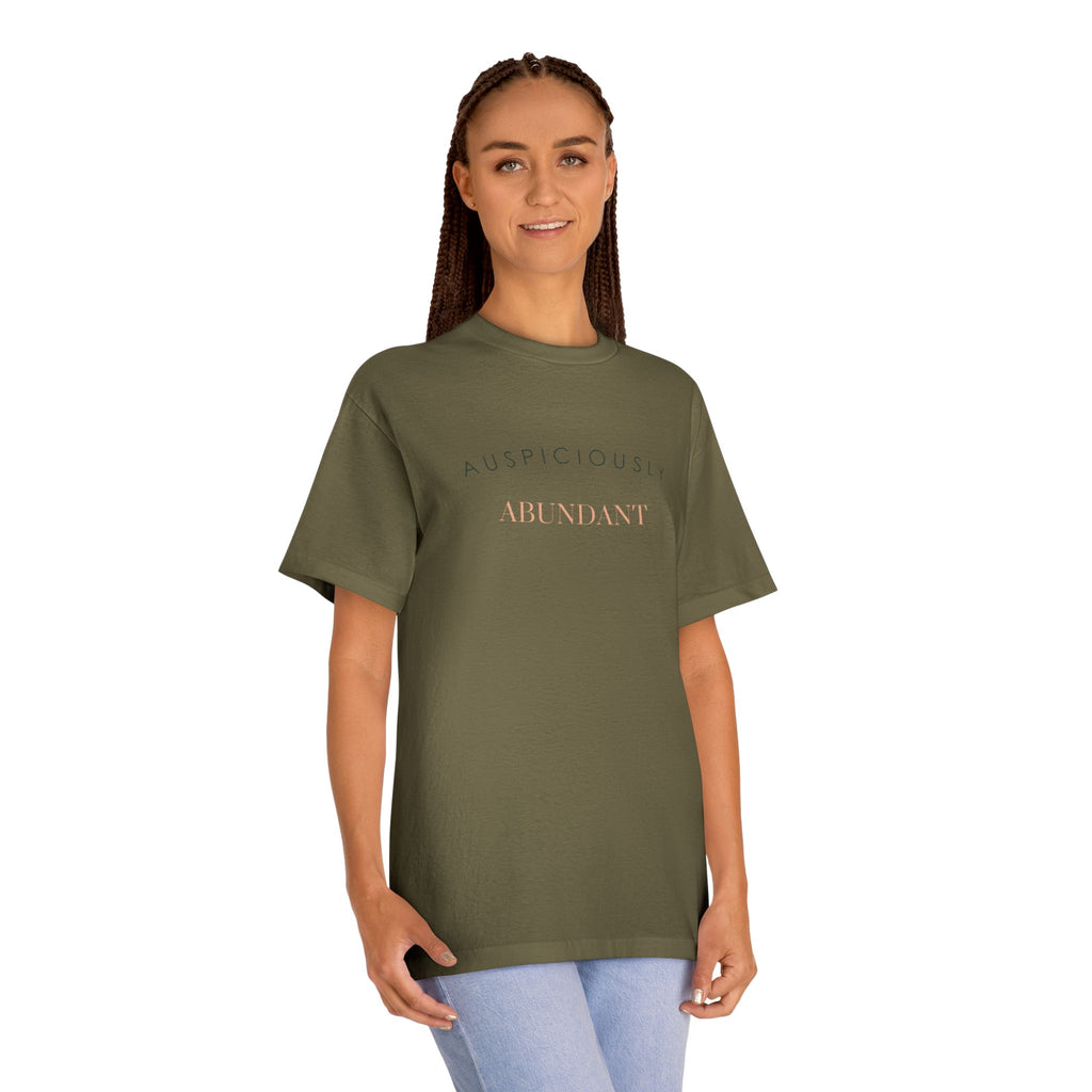 Military green crewneck tee with gold “Auspiciously Abundant” text graphic on front