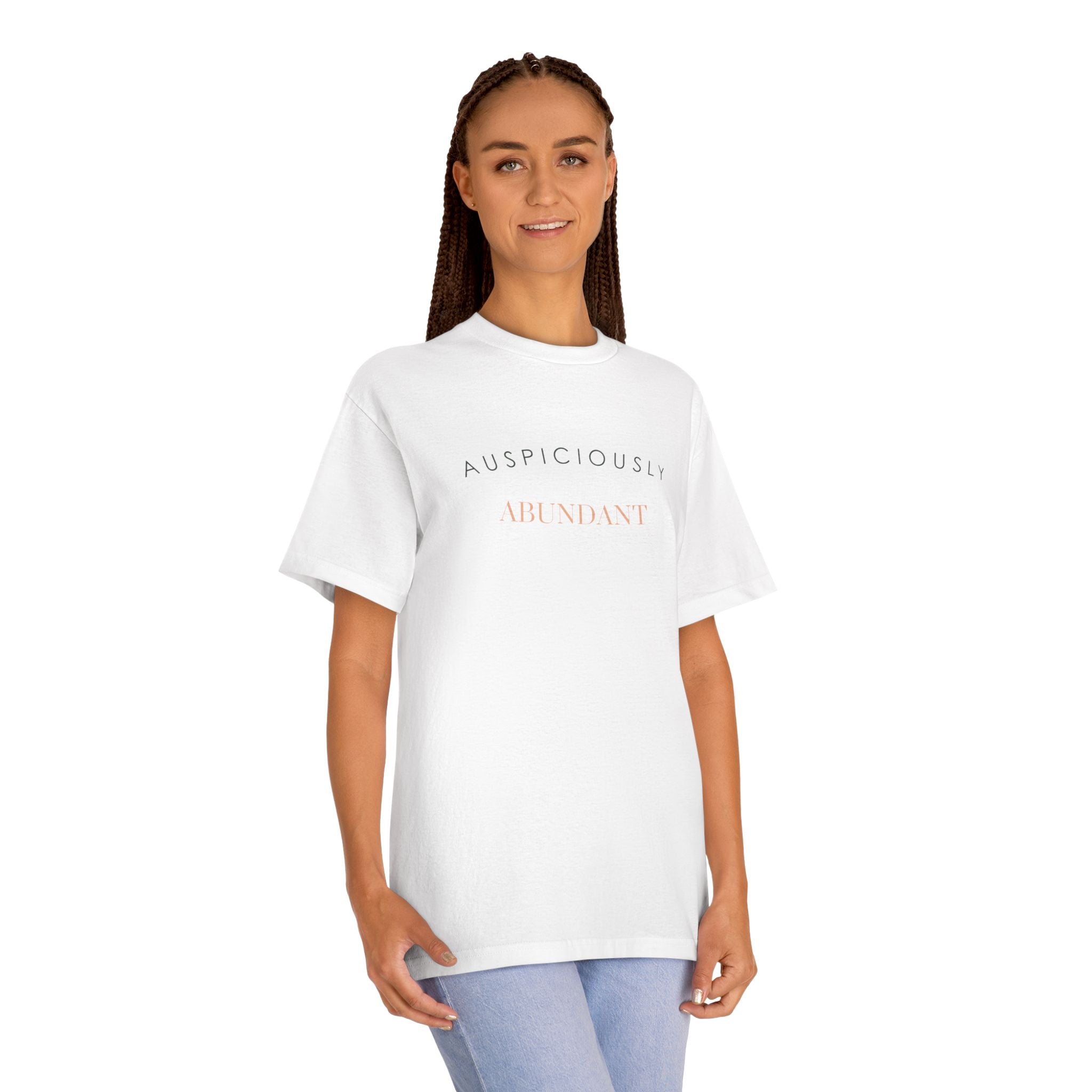 White crewneck tee with gold “Auspiciously Abundant” text graphic on front