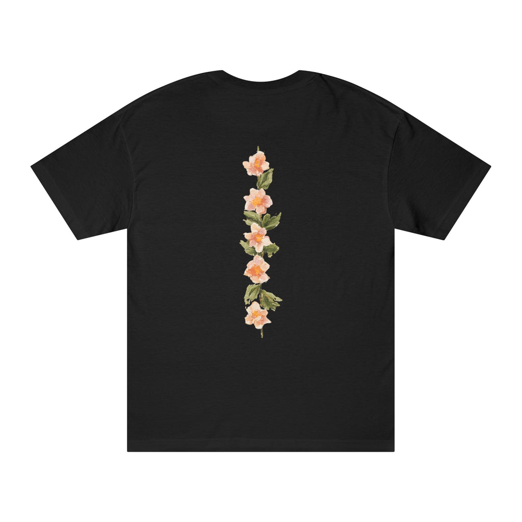 Black crewneck tee with vertical floral back graphic in peach and green