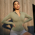 Khaki zip-up active jacket with long sleeves and front pockets.