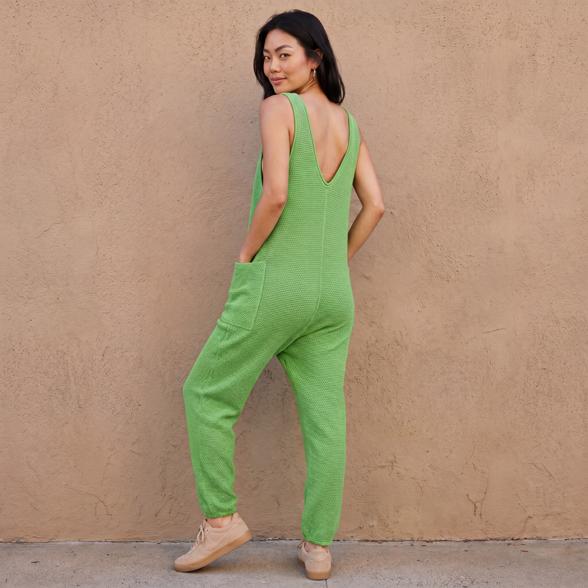 Green knit sleeveless wide-leg pocket jumpsuit, back view