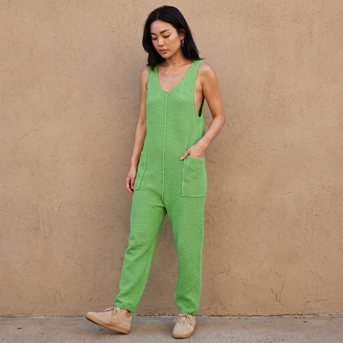 Green knit sleeveless jumpsuit romper with wide legs and front pocket