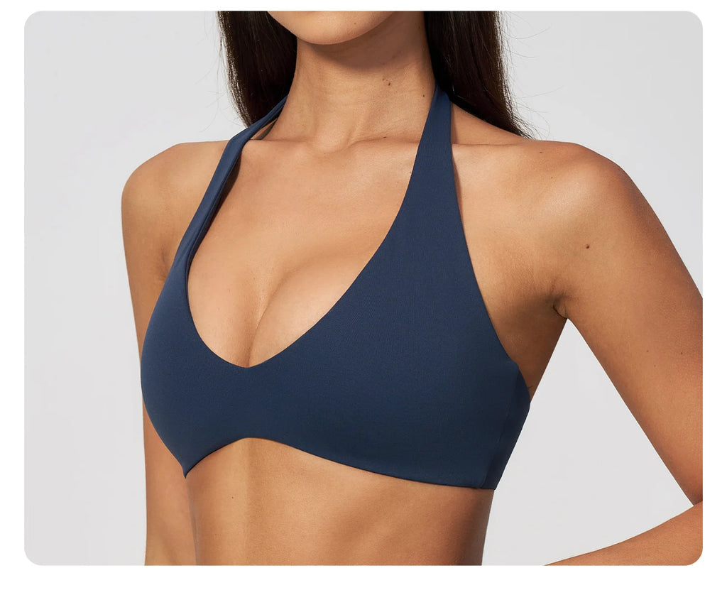 Dark blue halter yoga bra with deep V neckline and racerback cutout