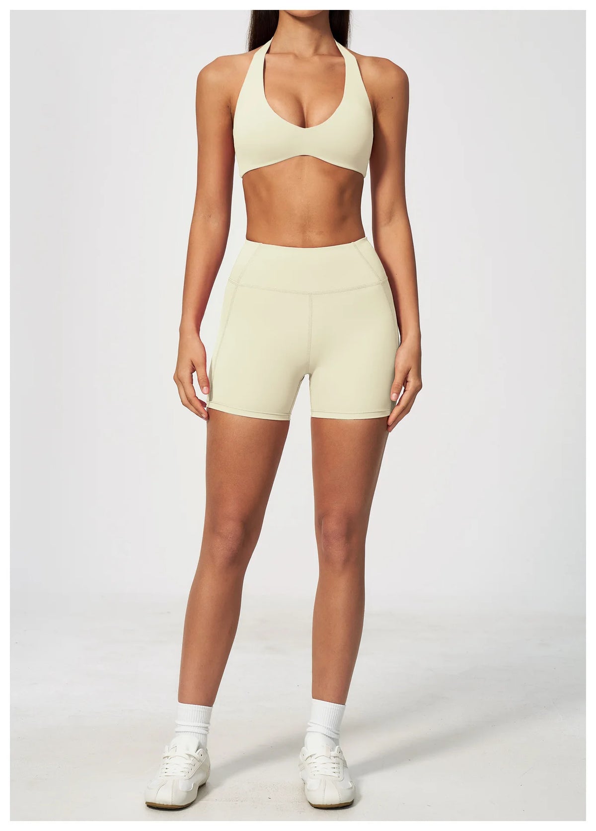 Creamy white halter yoga bra with deep V front and sporty crop fit