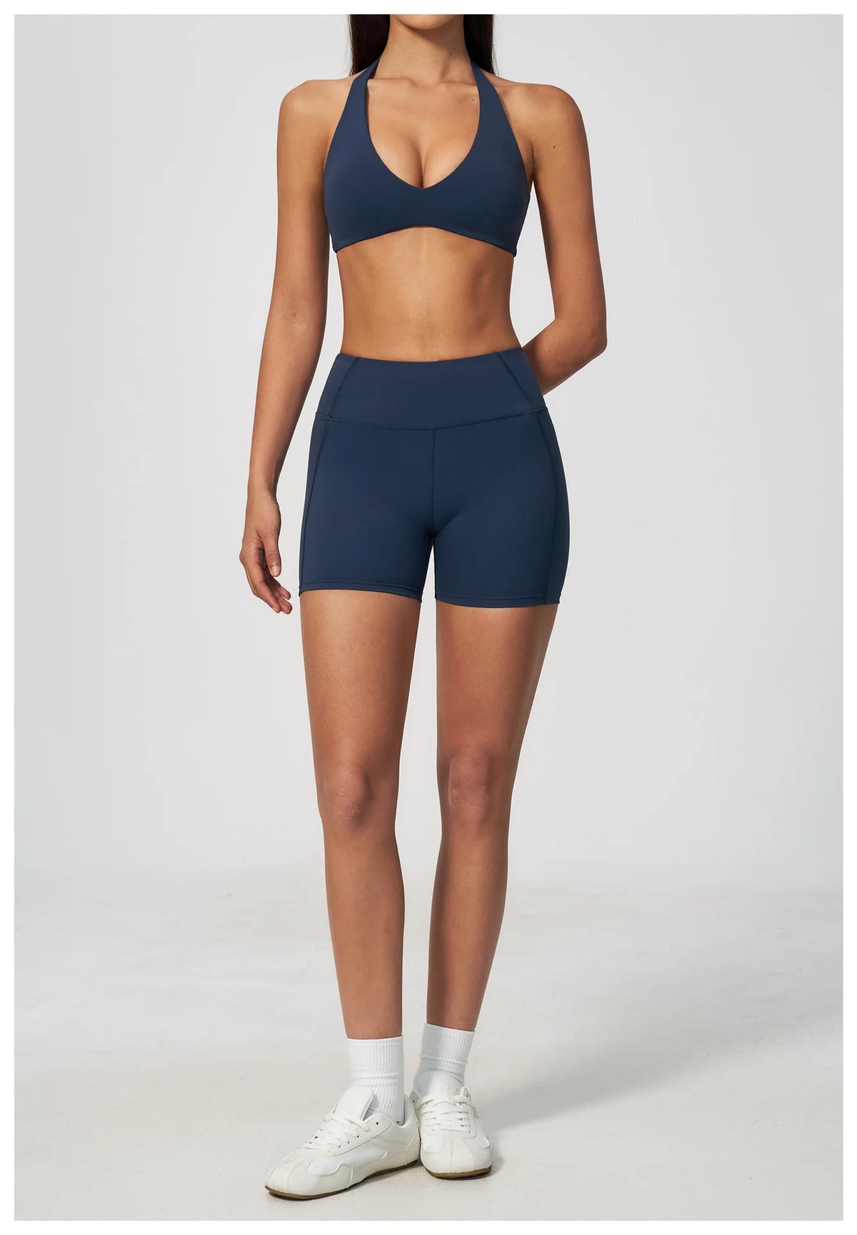 Dark blue halter yoga bra with deep V front neckline, sports fit