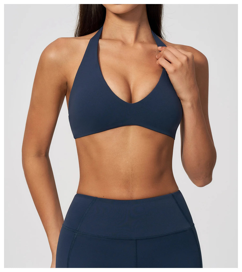 Dark blue halter yoga bra with deep V front and matching athletic support
