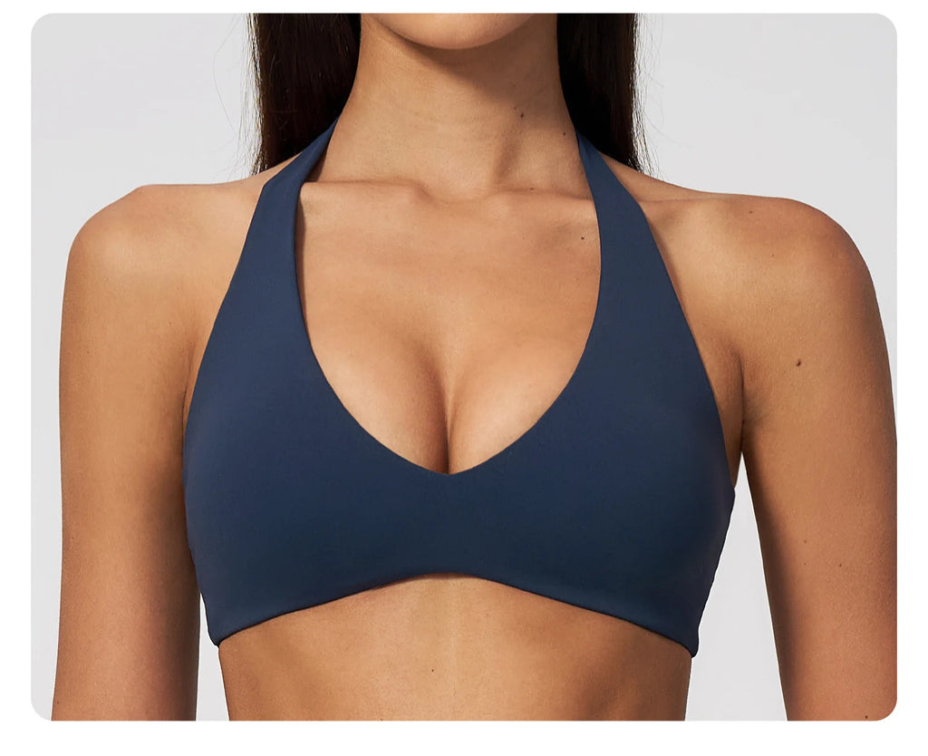 Badge blue halter yoga sports bra close-up with deep V front and smooth fabric