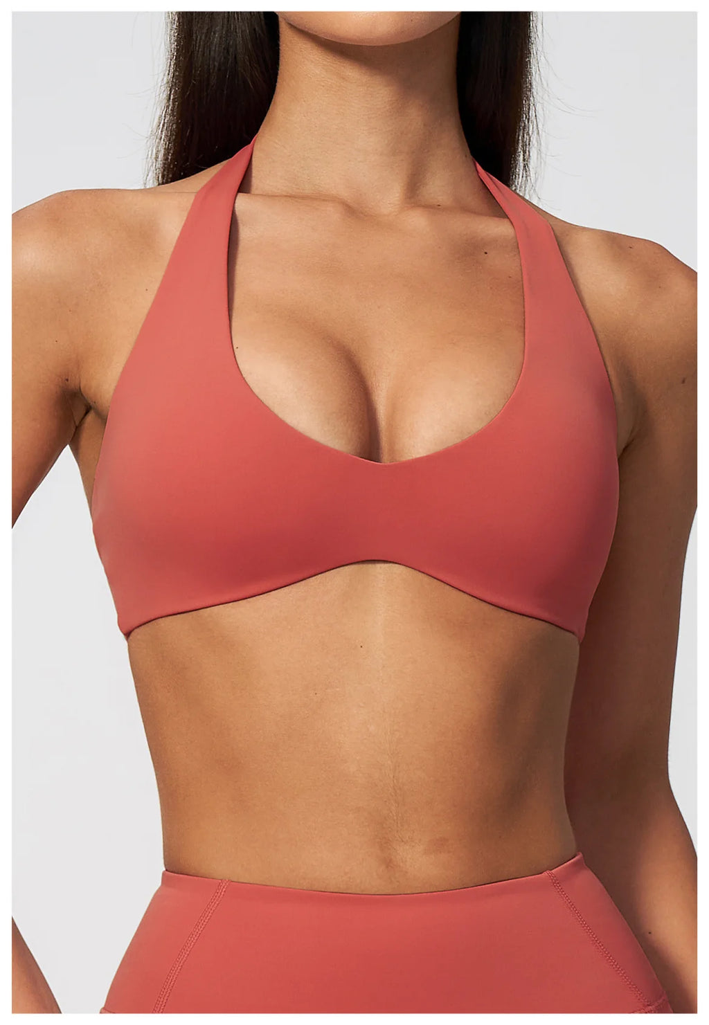 Coral red halter neck yoga bra with deep V front and racerback cut