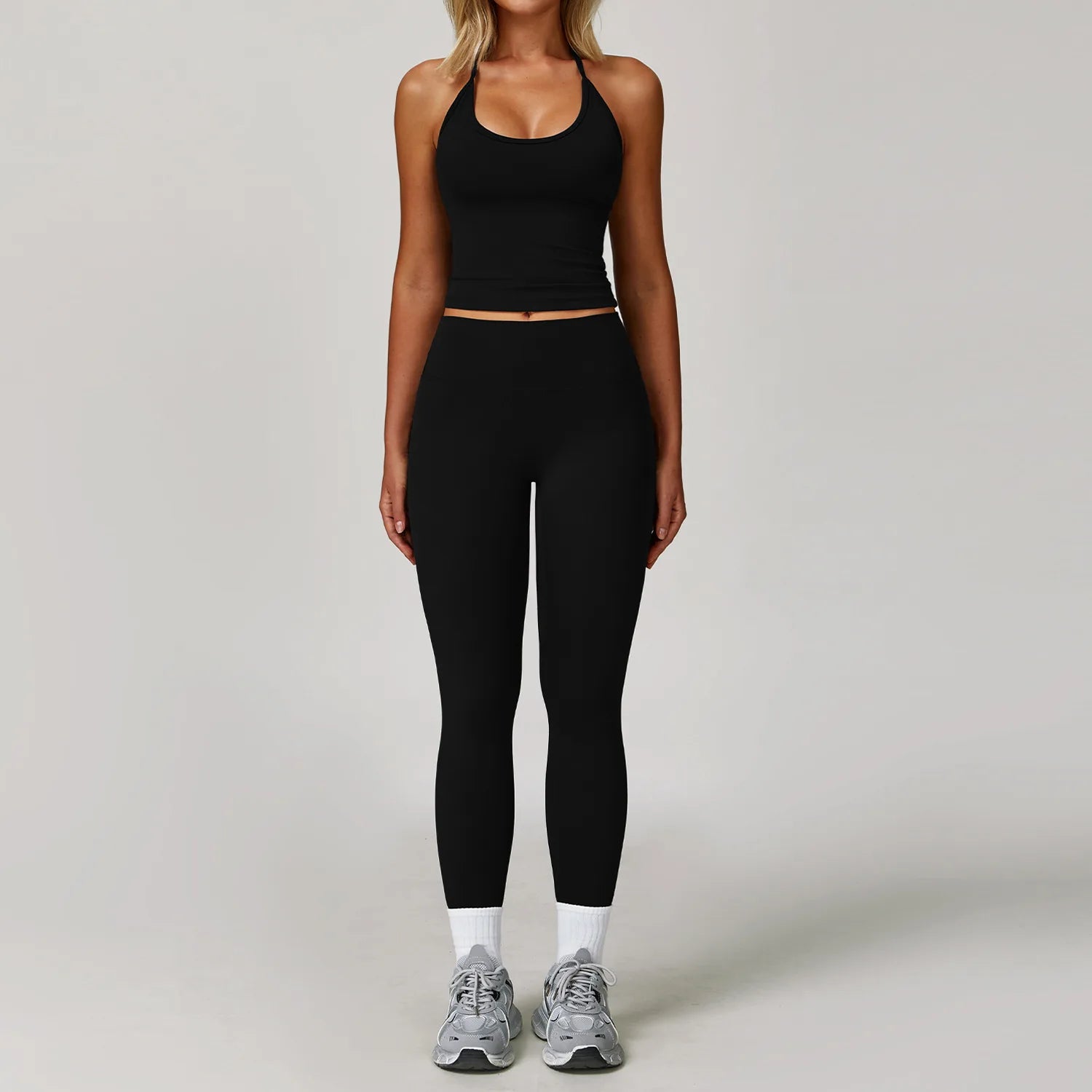 Xooie Fit halter tank top and leggings set in black, perfect for workouts and casual wear