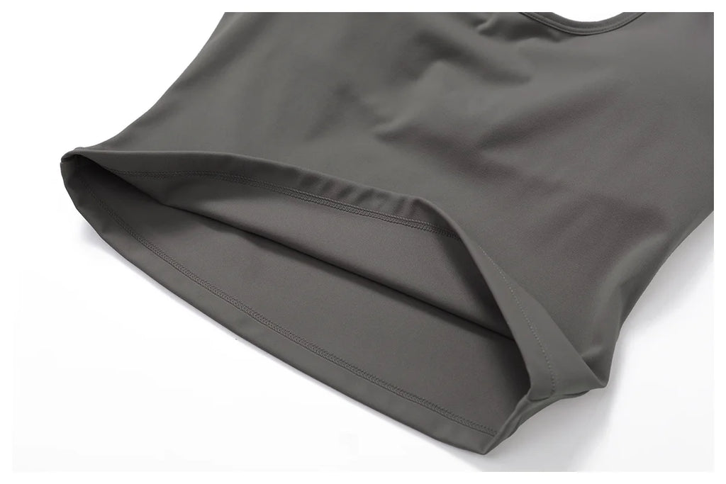 Close-up of the hem of a halter tank top from the halter tank top and leggings set by Xooie Fit