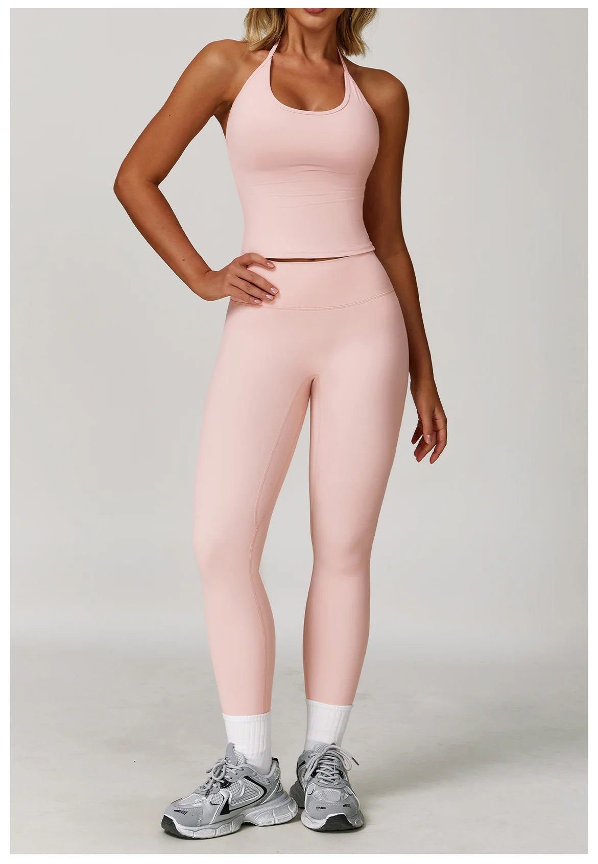 Xooie Fit halter tank top and leggings set in soft pink, perfect for workouts and casual wear