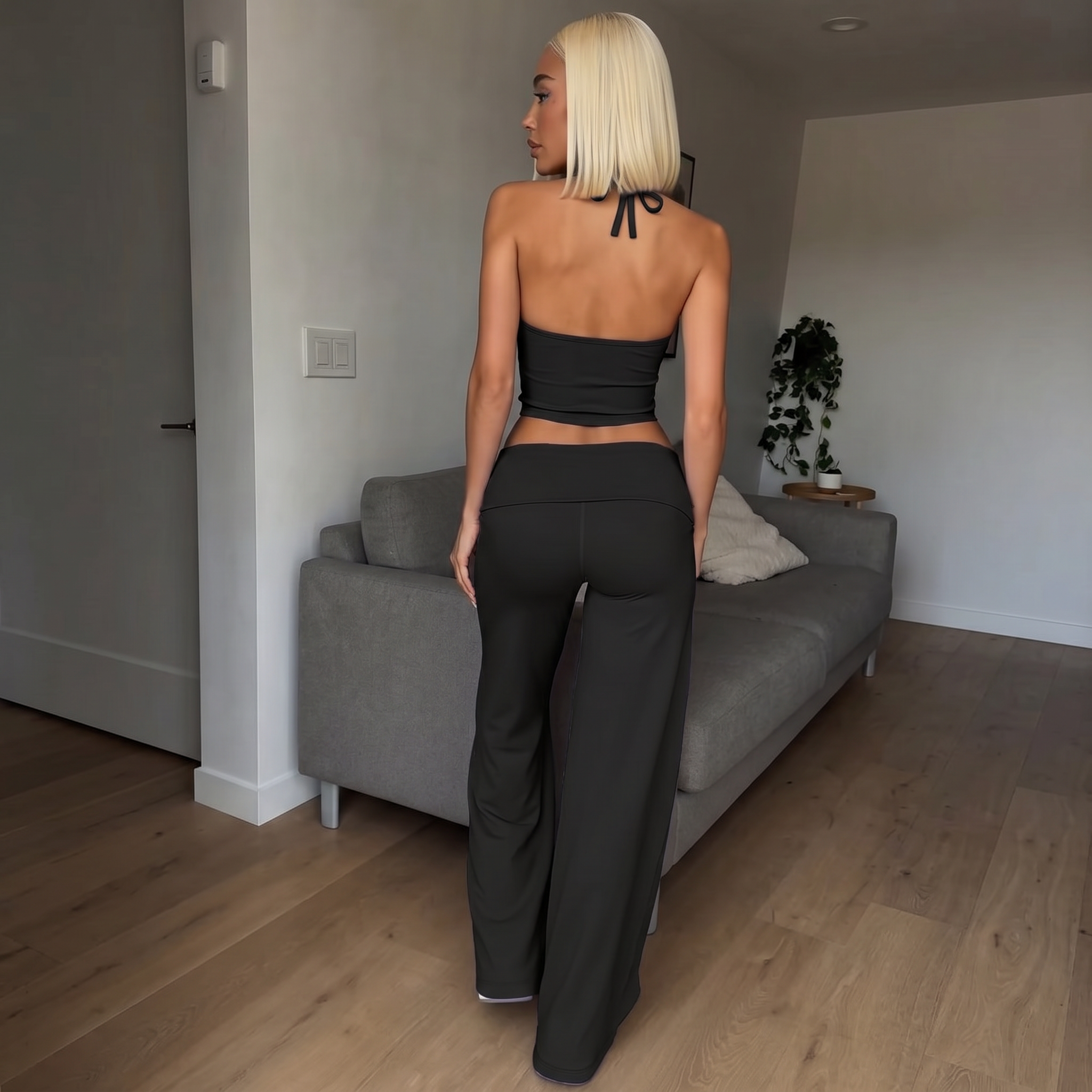 Black halter crop top with matching flare pants, back tie ribbon detail