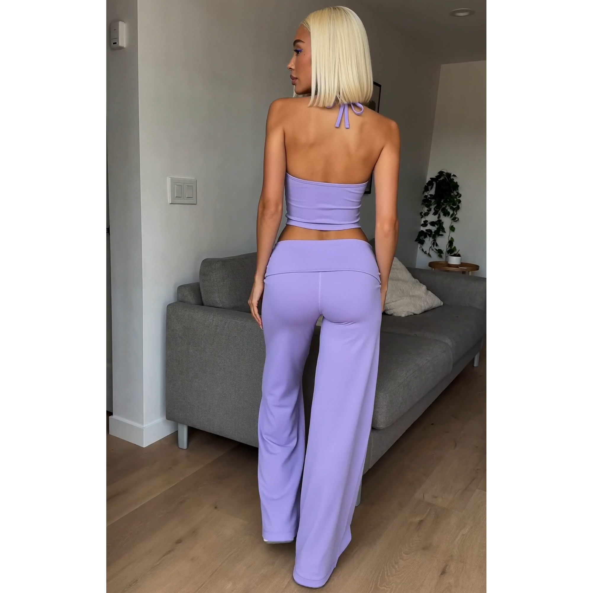 Purple halter spaghetti-strap crop top and matching flare pants, back tie detail