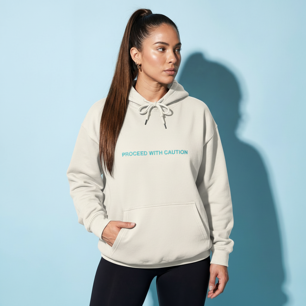 Graphic fleece hoodie, off white front with “Proceed With Caution” text and kangaroo pocket