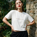 Women’s boxy crop T-shirt, white, front word print