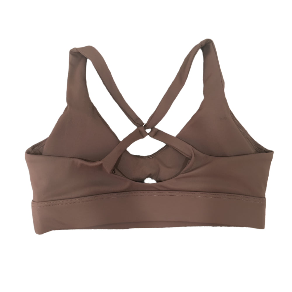 Xooie Fit high-intensity sports bra in brown with crossed back straps for optimal support during workouts