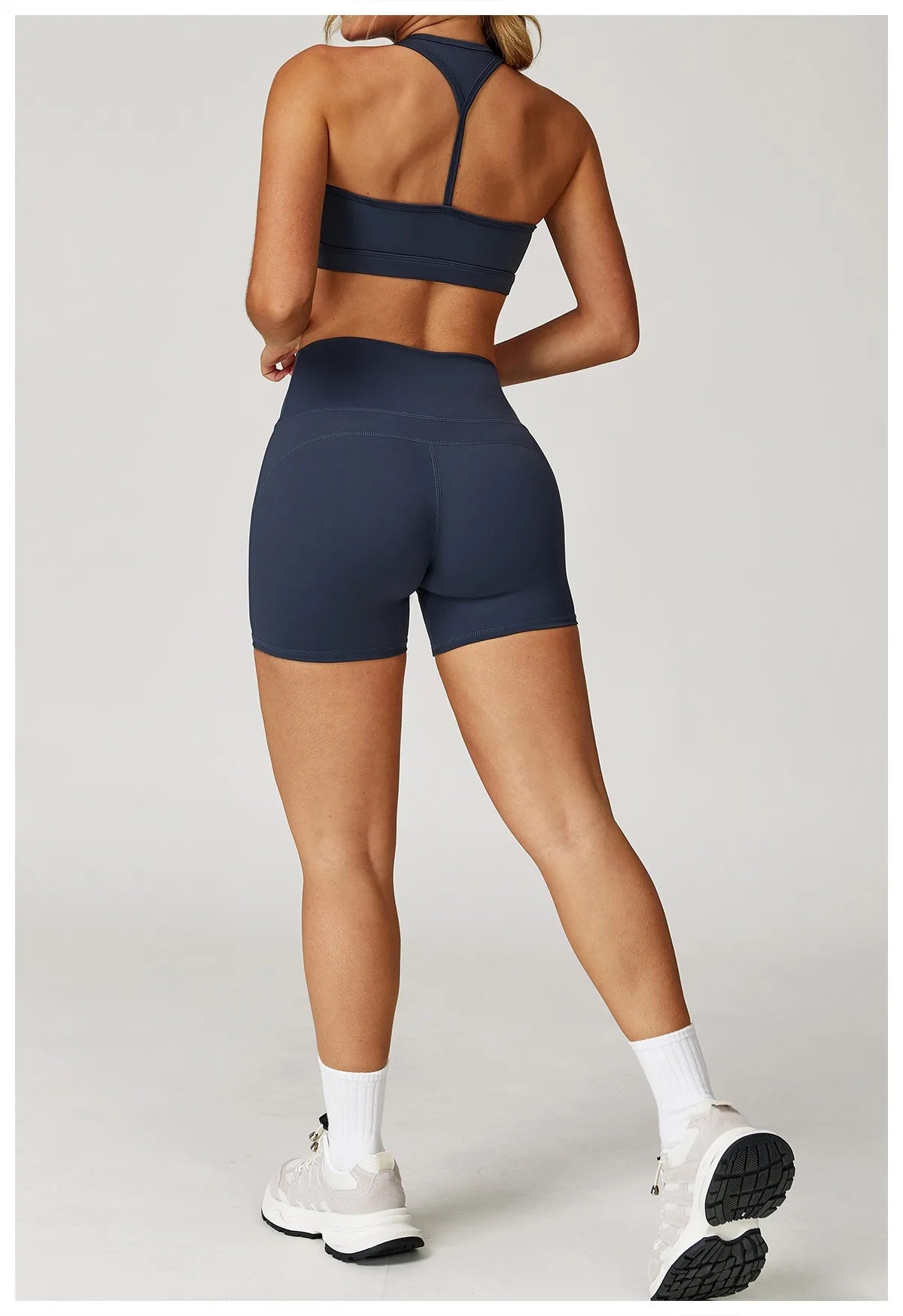 Xooie Fit navy two-piece set with high-performance activewear shorts and crop top for workout