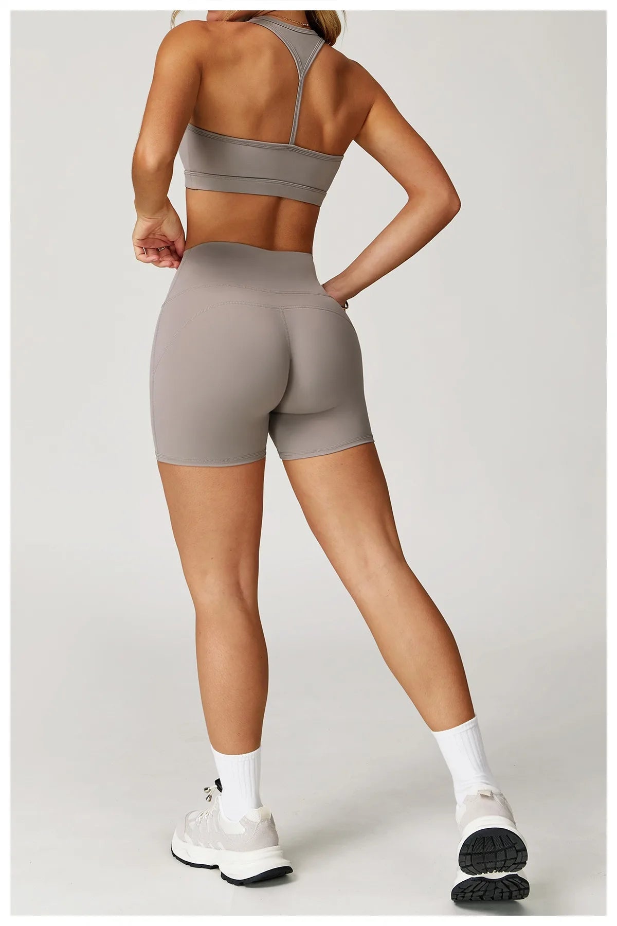 Xooie Fit two-piece set featuring high-performance activewear shorts and sports bra in taupe