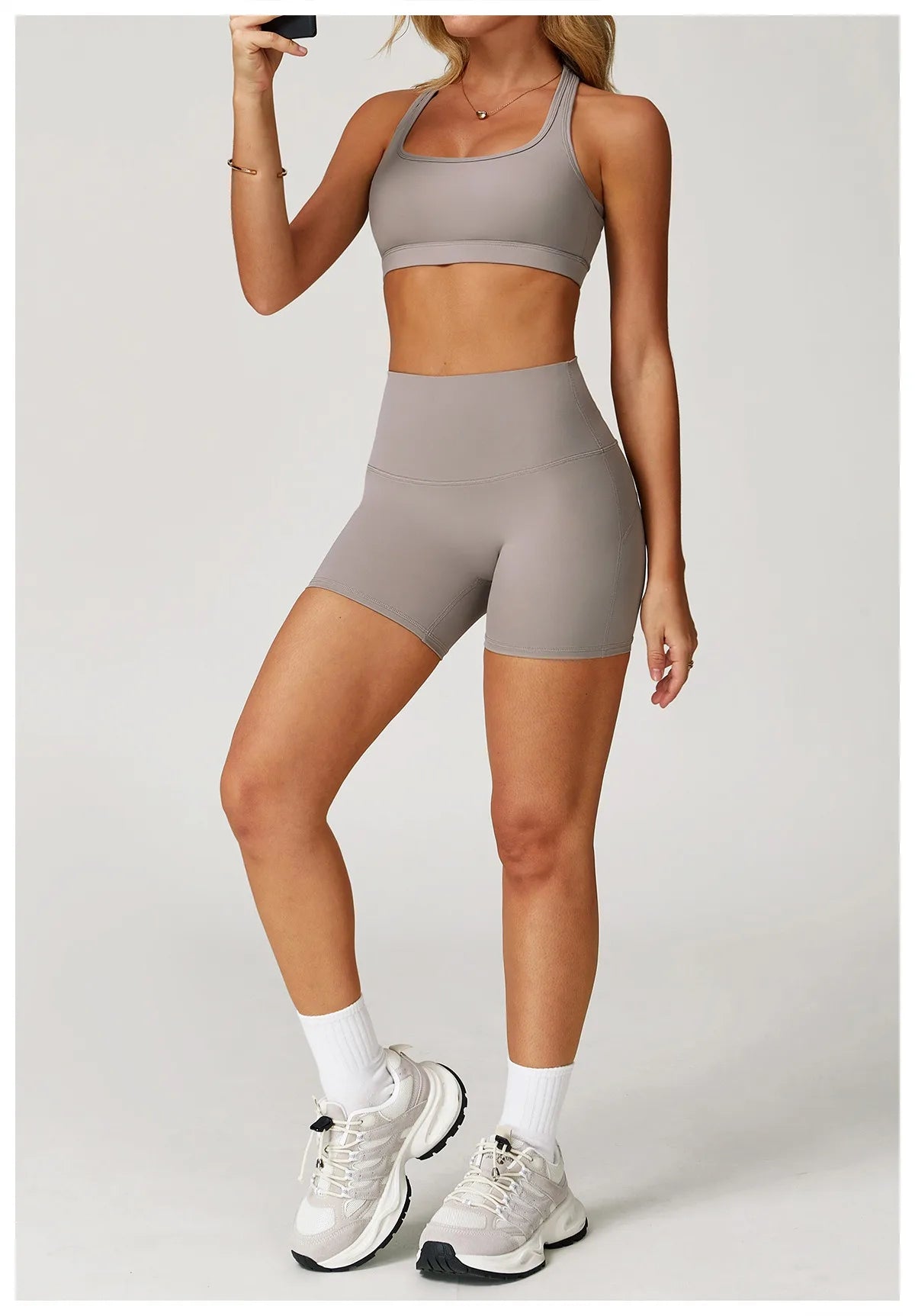 Xooie Fit two-piece set of high-performance activewear with a sports bra and high-waisted shorts in gray